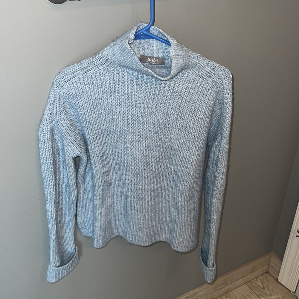 Light blue turtle neck!